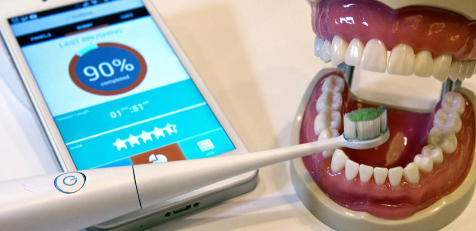 A Kolibree connected electric toothbrush is displayed during the 2014 International Consumer Electronics Show (CES) in Las Vegas, Nevada, January 8, 2014. The smart toothbrush uses an accelerometer, gyroscope and magnetometer to track how well users brush their teeth. The French company expects the toothbrush will be available in the third quarter of 2014 and retail for $99.00 to $199.00 depending on the model. REUTERS/Steve Marcus (UNITED STATES - Tags: BUSINESS SCIENCE TECHNOLOGY)